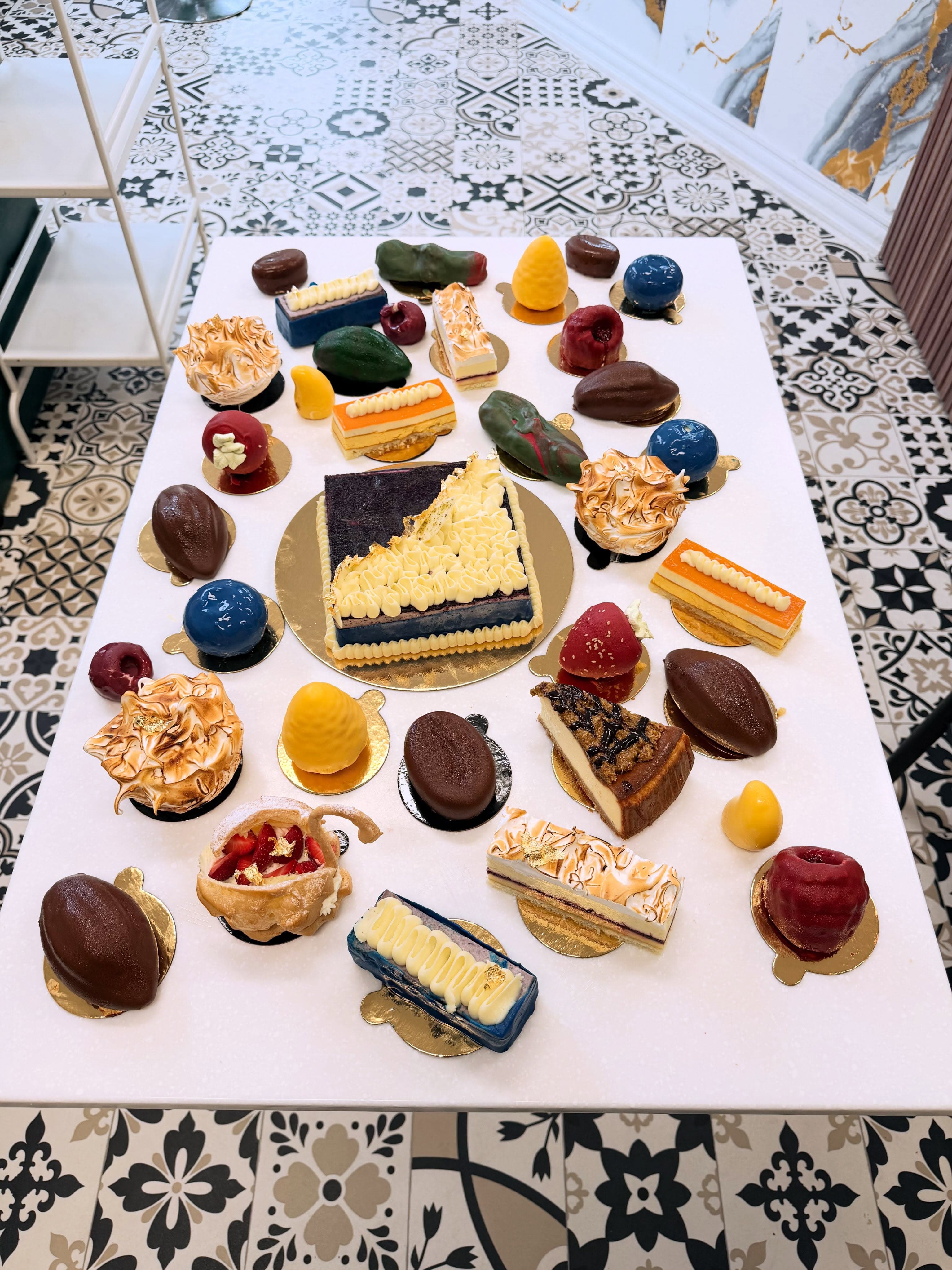 An assortment of Casablanca pastries and desserts on a patterned table